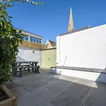 Vibrant Spring Street With Garden